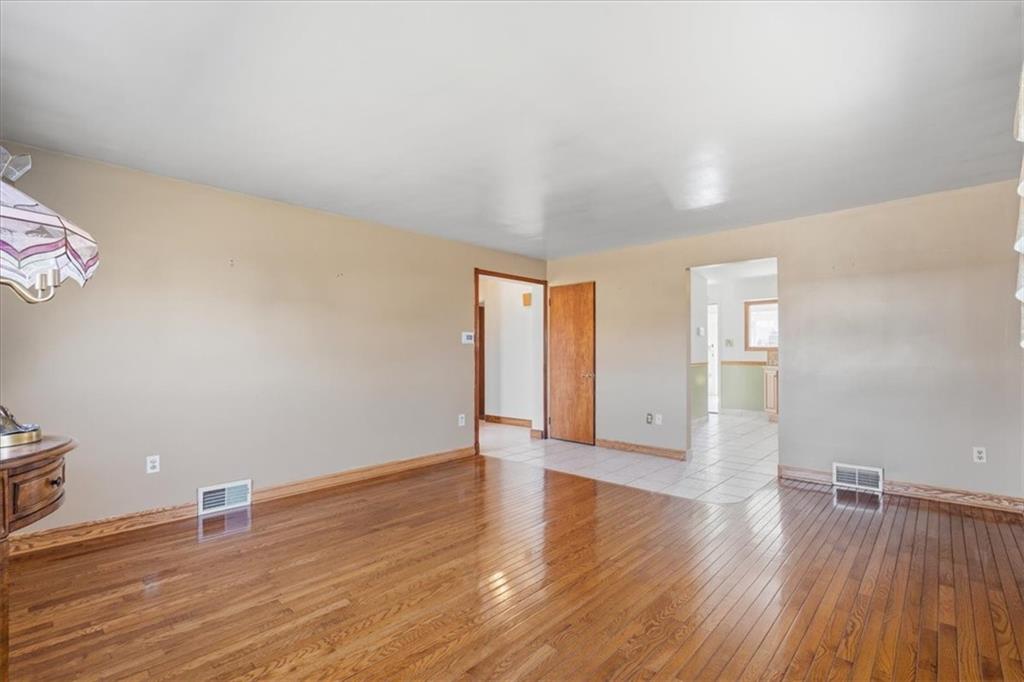 2355 Calvert Street Aliquippa, PA 15001 - Photo 16 of 28 a view of an empty room with wooden floor and a window