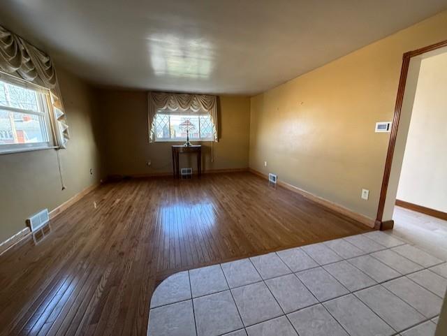 2355 Calvert Street Aliquippa, PA 15001 - Photo 17 of 28 wooden floor in an empty room with a window