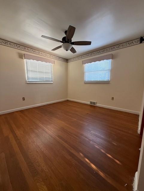 2355 Calvert Street Aliquippa, PA 15001 - Photo 19 of 28 an empty room with wooden floor ceiling fan and windows