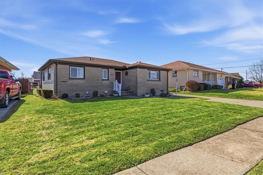 2355 Calvert Street Aliquippa, PA 15001 - Photo 2 of 28 a front view of a house with garden