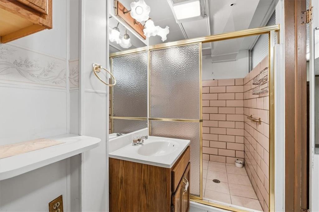 2355 Calvert Street Aliquippa, PA 15001 - Photo 27 of 28 a bathroom with a sink and a mirror