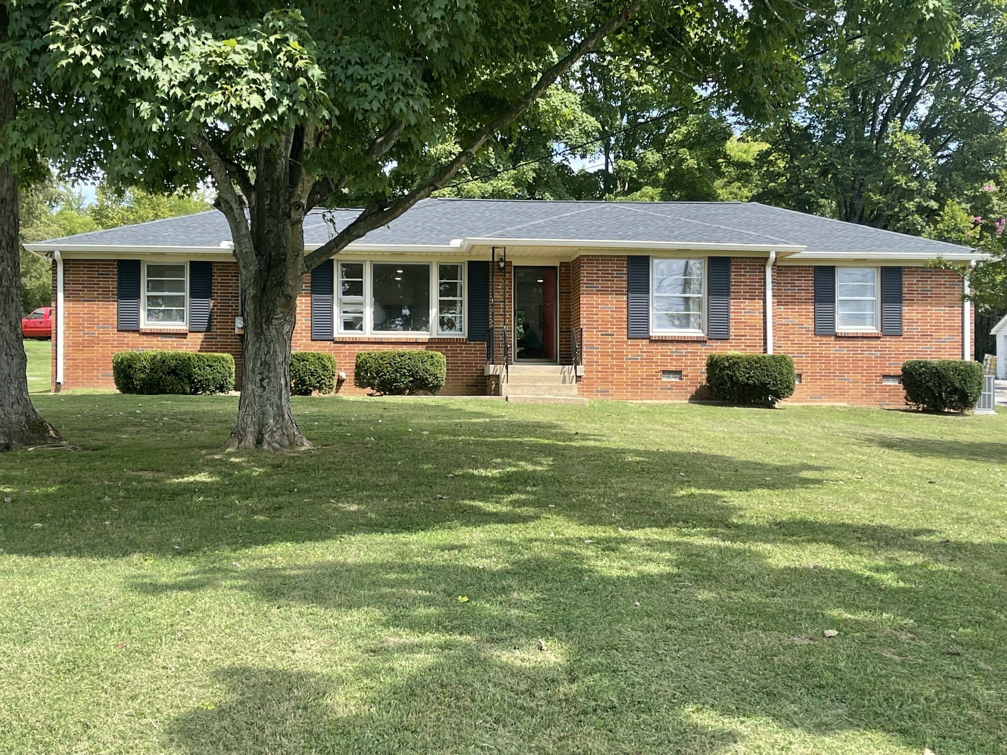 10515 Lebanon Road Mount Juliet, TN 37122 - Photo 2 of 13 a front view of a house with a yard and trees