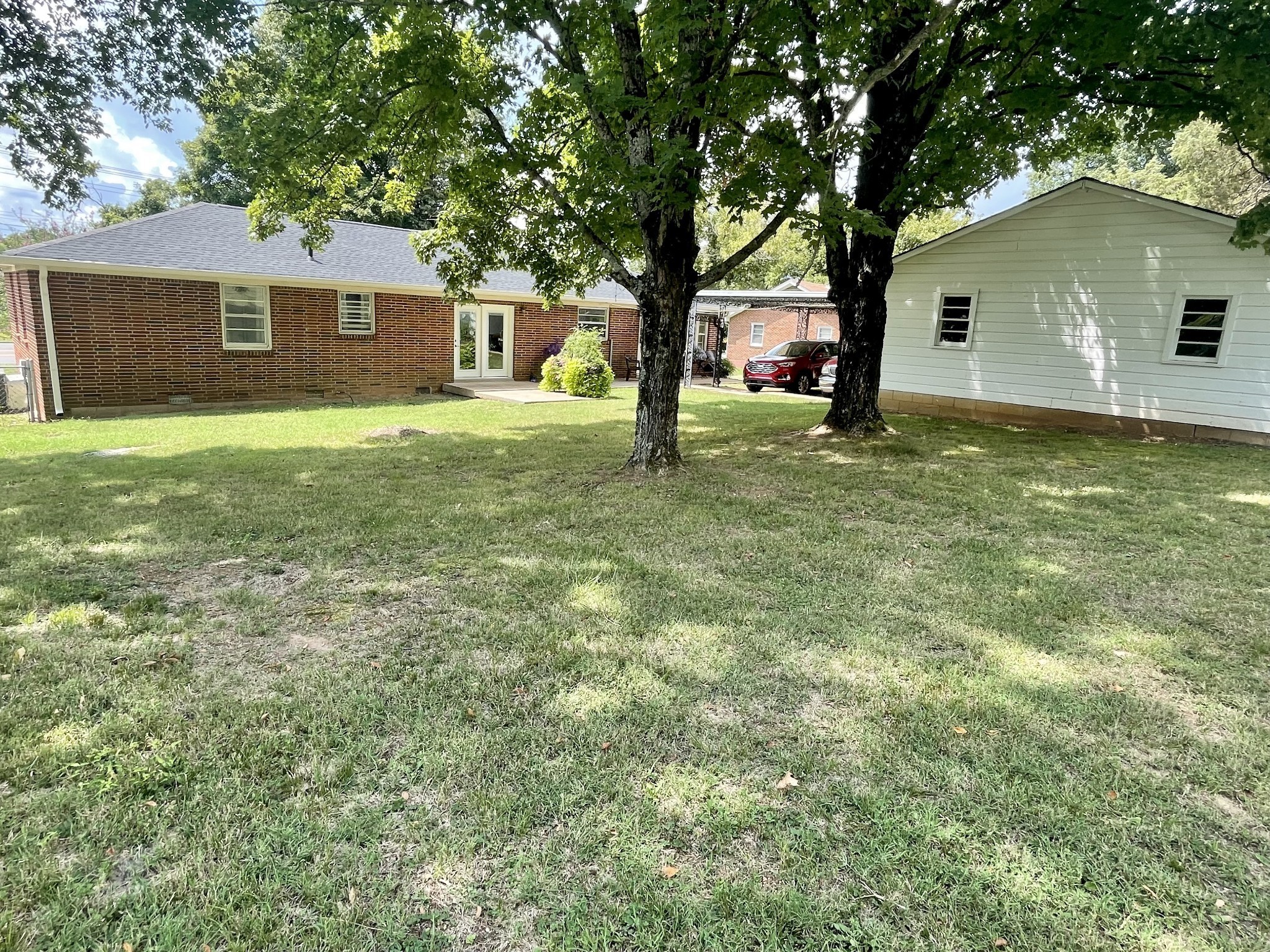10515 Lebanon Road Mount Juliet, TN 37122 - Photo 3 of 13 a house with huge green field in front of it