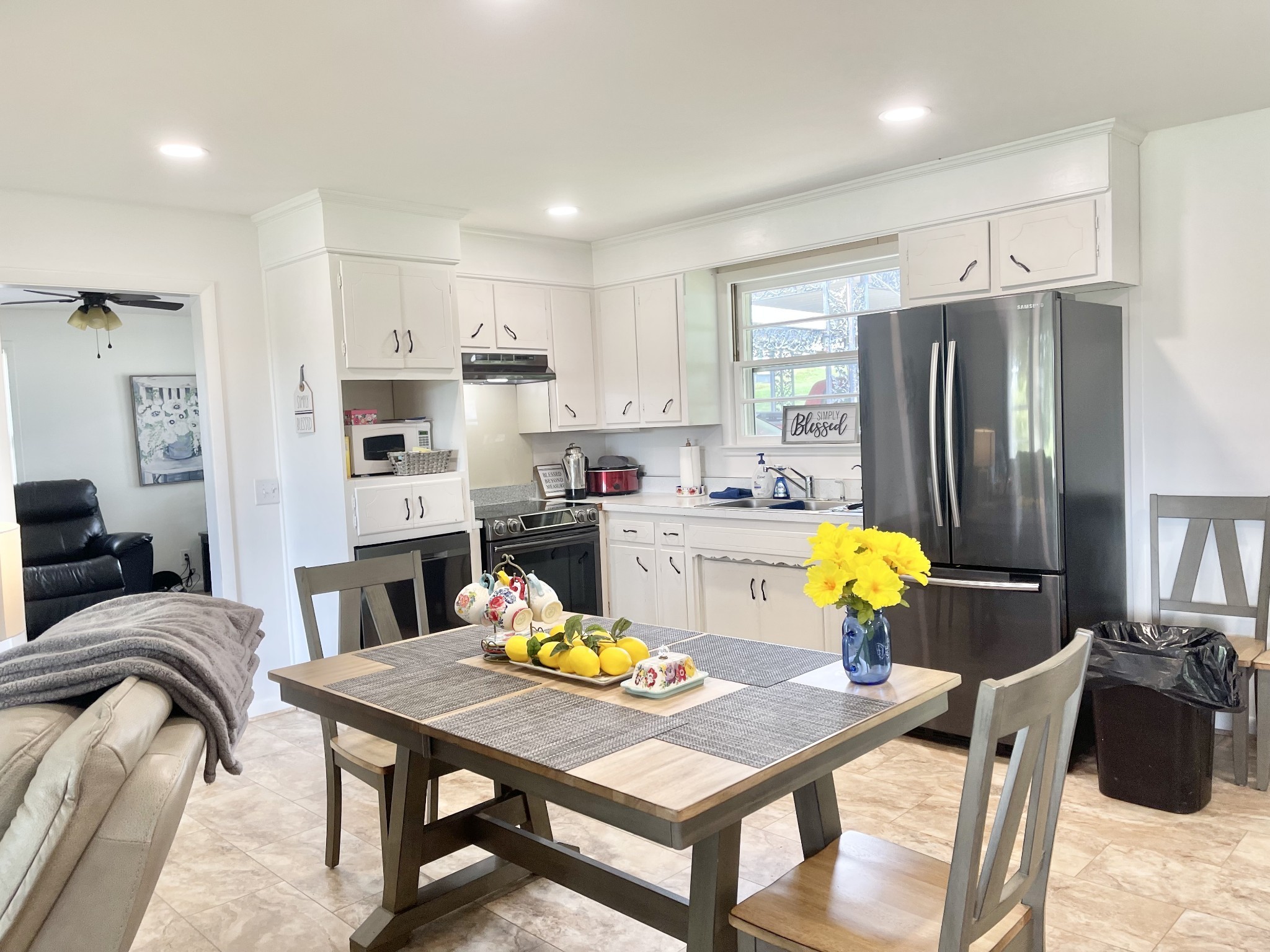 10515 Lebanon Road Mount Juliet, TN 37122 - Photo 6 of 13 a living room with stainless steel appliances furniture a rug and a kitchen view