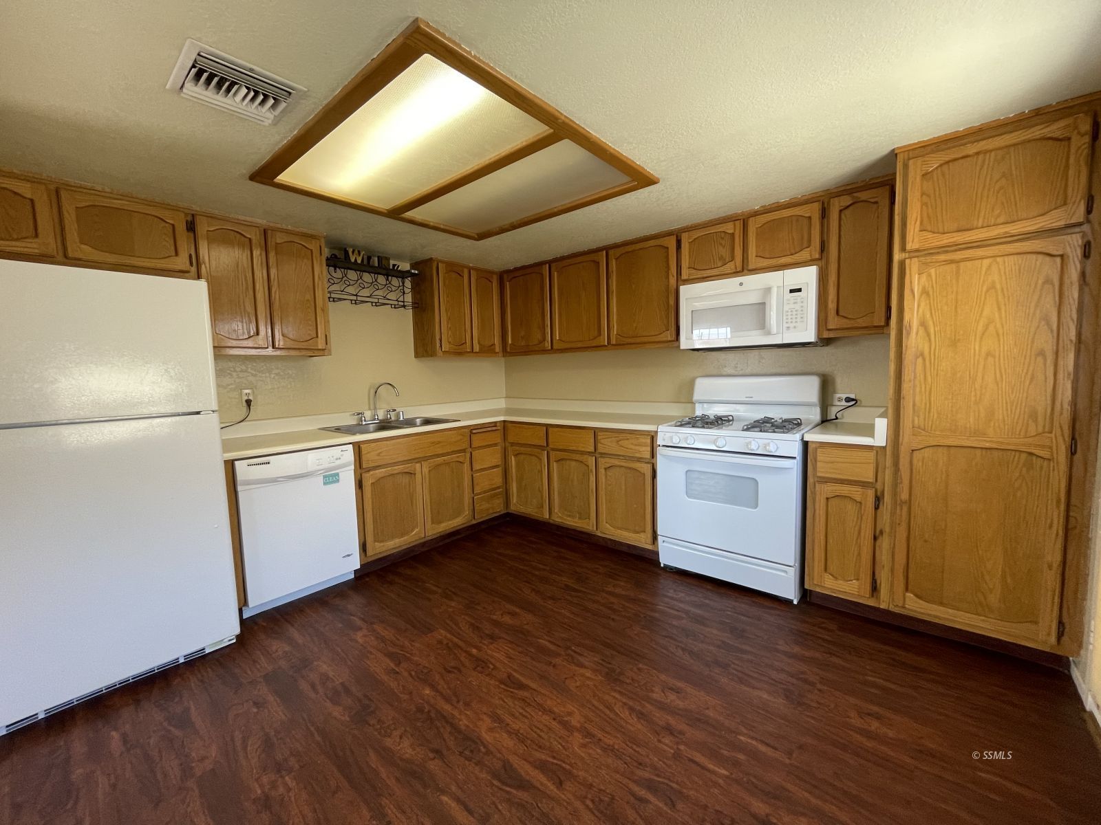 317 North Florence Street Ridgecrest, CA 93555 - Photo 9 of 19 a kitchen with stainless steel appliances a refrigerator sink and microwave