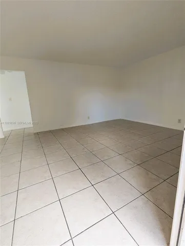 a kitchen with cabinets stainless steel appliances and a sink