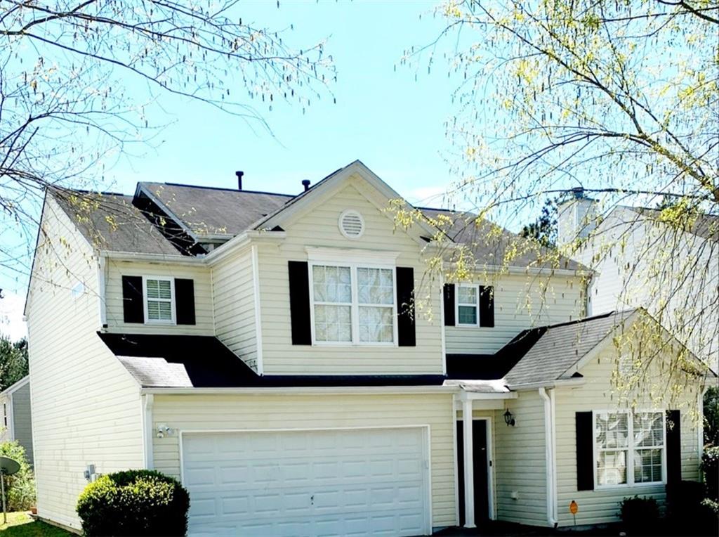 3551 Devon Chase Road Atlanta, GA 30349 - Photo 1 of 1 a front view of a house with a tree