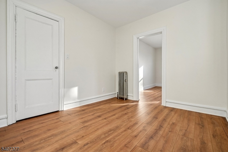 60 Union Avenue Nutley, NJ 07110 - Photo 15 of 17 an empty room with wooden floor and closet