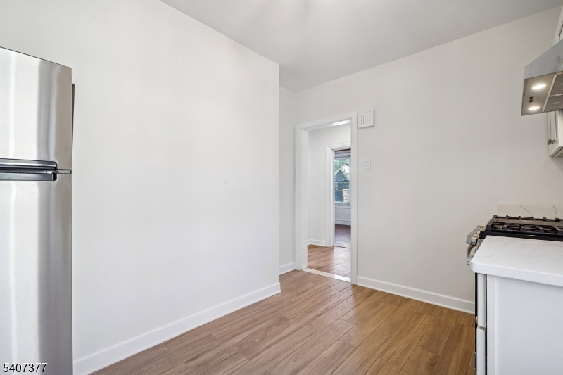 60 Union Avenue Nutley, NJ 07110 - Photo 4 of 17 a view of empty room with wooden floor