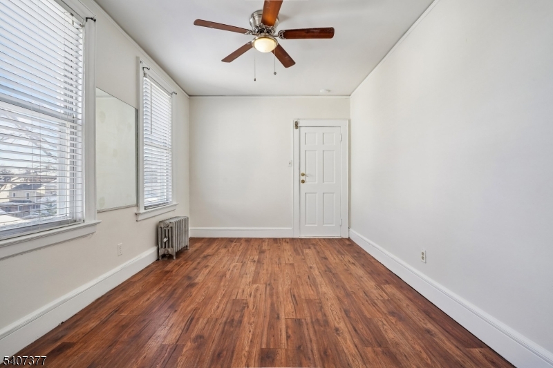 60 Union Avenue Nutley, NJ 07110 - Photo 7 of 17 wooden floor in an empty room with a window