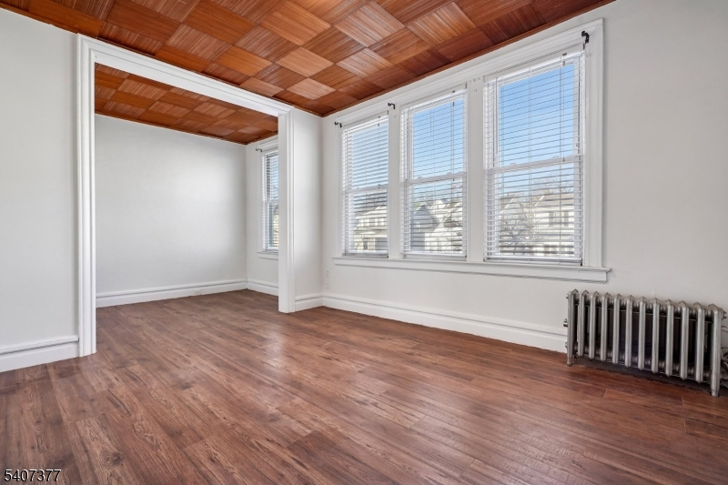 60 Union Avenue Nutley, NJ 07110 - Photo 9 of 17 a view of an empty room with wooden floor and a window