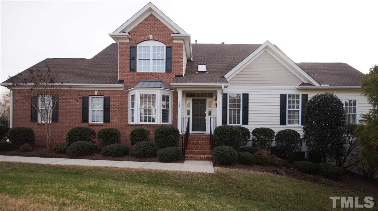 11032 Fair Chase Court Raleigh, NC 27617 - Photo 1 of 25 a front view of a house with garden