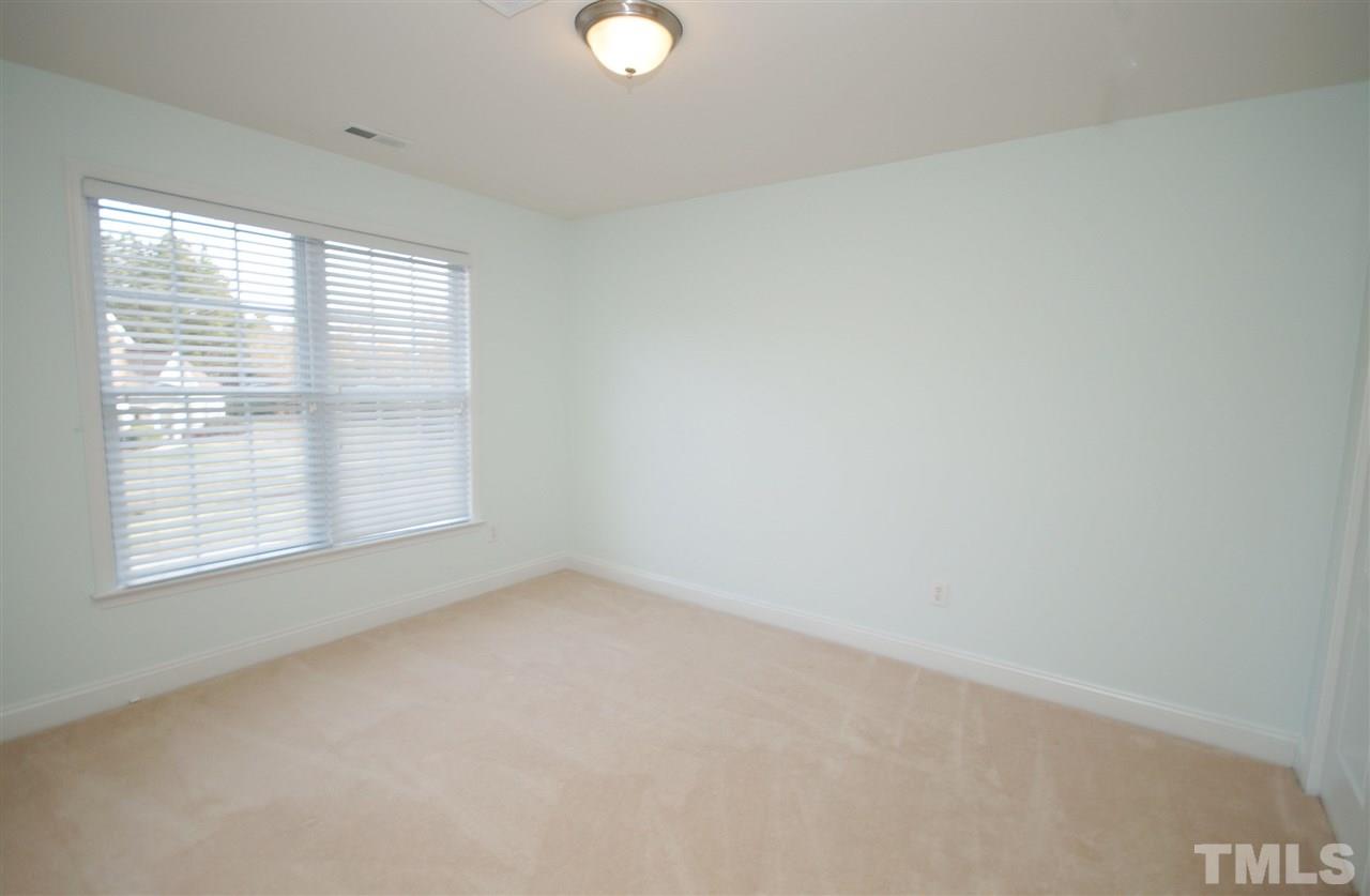 11032 Fair Chase Court Raleigh, NC 27617 - Photo 19 of 25 a view of an empty room with a window