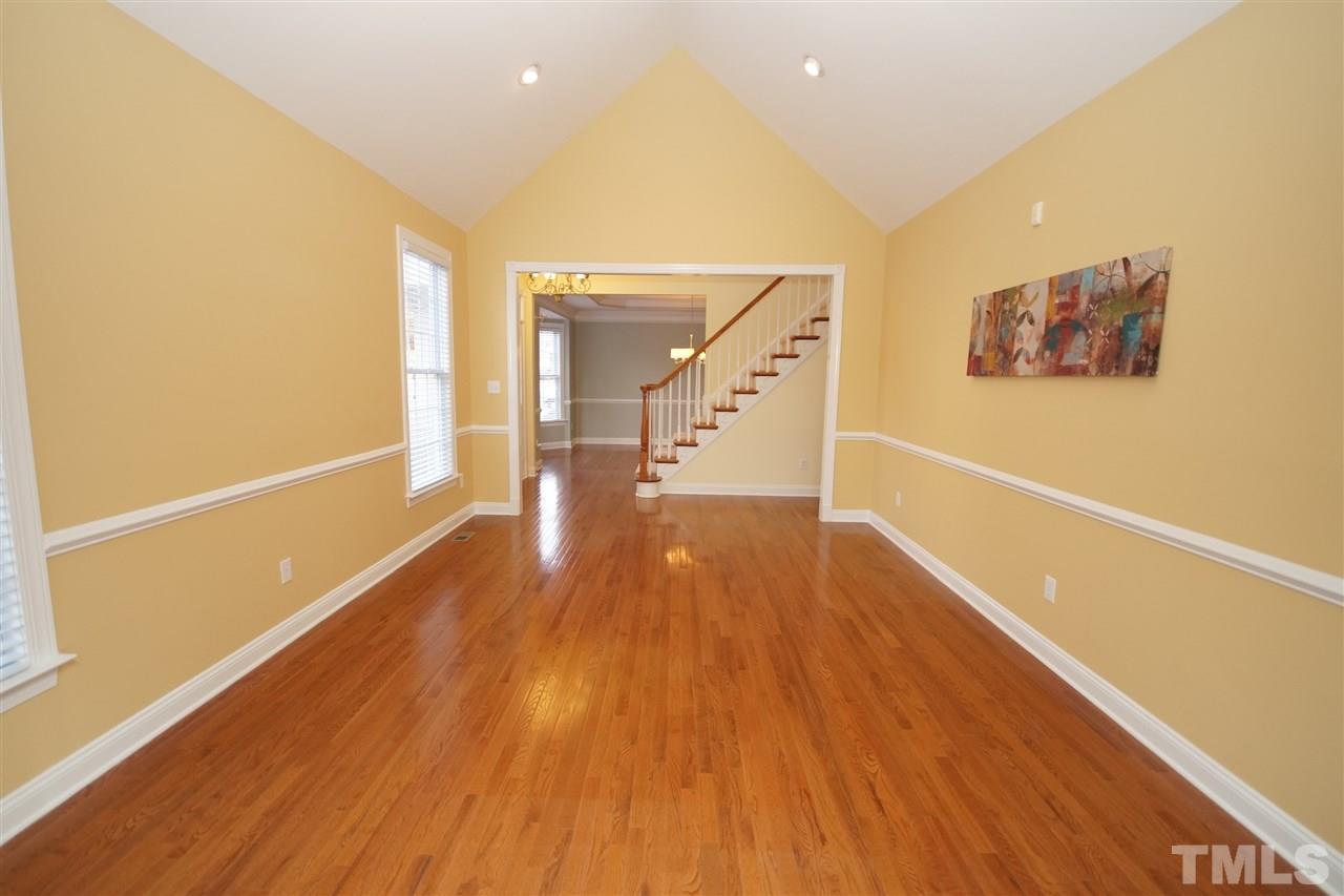 11032 Fair Chase Court Raleigh, NC 27617 - Photo 4 of 25 a view of a hallway with wooden floor