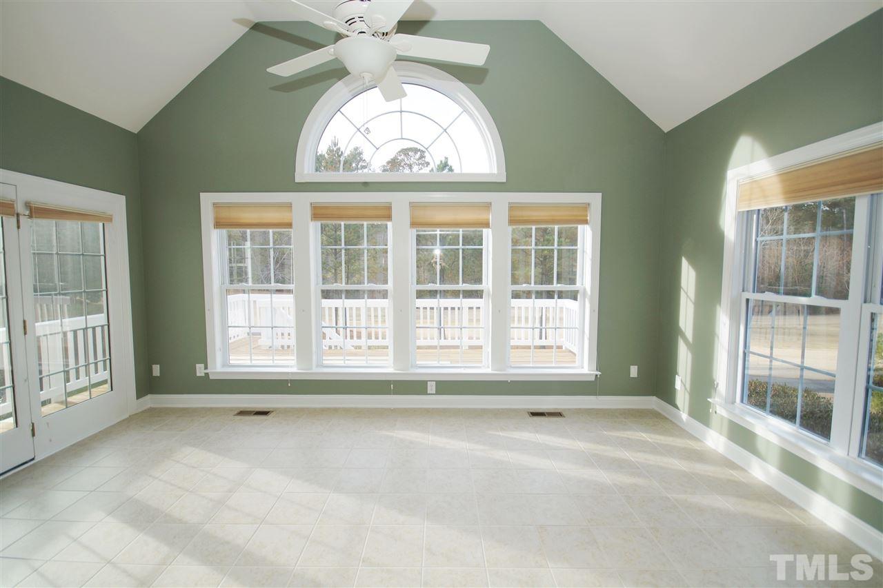 11032 Fair Chase Court Raleigh, NC 27617 - Photo 6 of 25 an empty room with a large window
