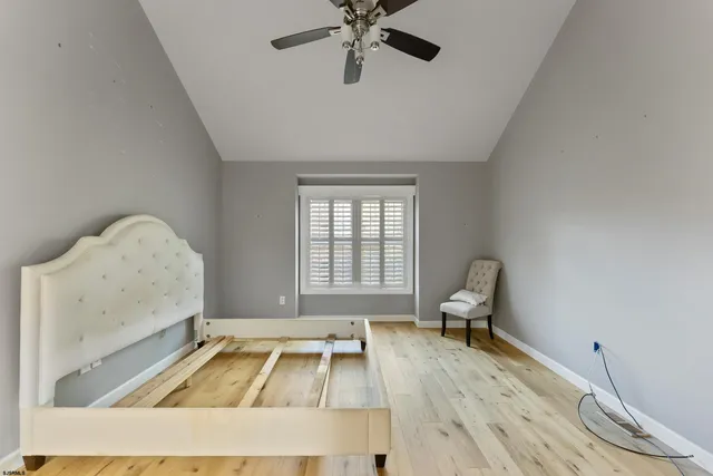 a living room with a couch and a chandelier
