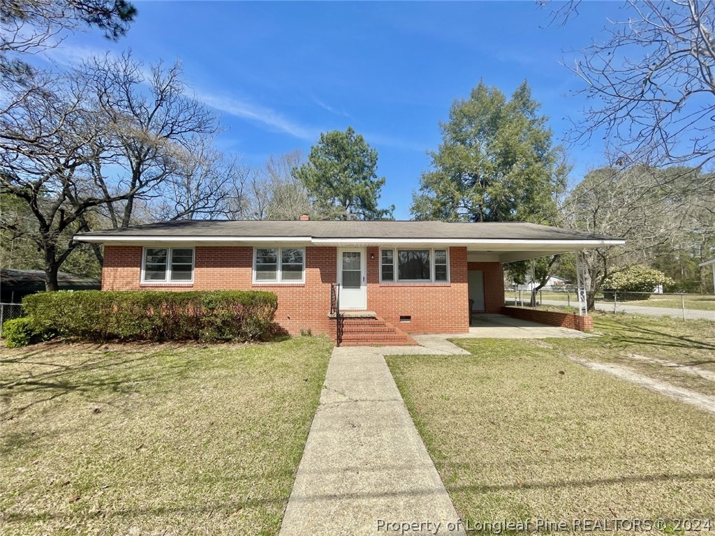 front view of a house with a yard