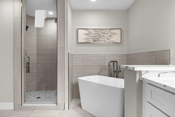 a bathroom with a bathtub and a sink