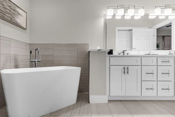 a bathroom with a sink a vanity and mirror