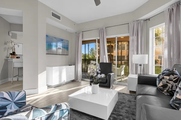 a living room with furniture and a large window