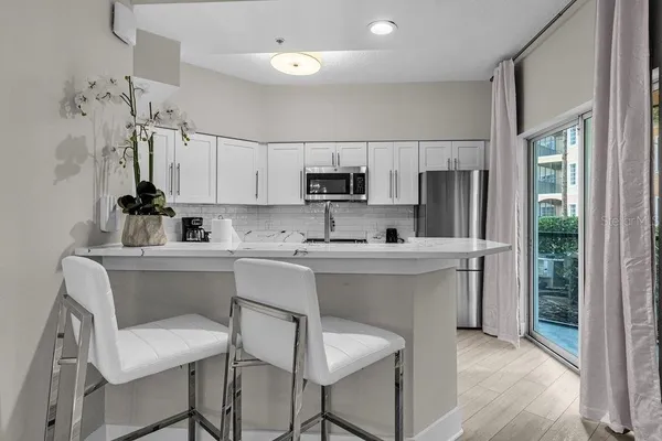 a kitchen with a sink cabinets and window