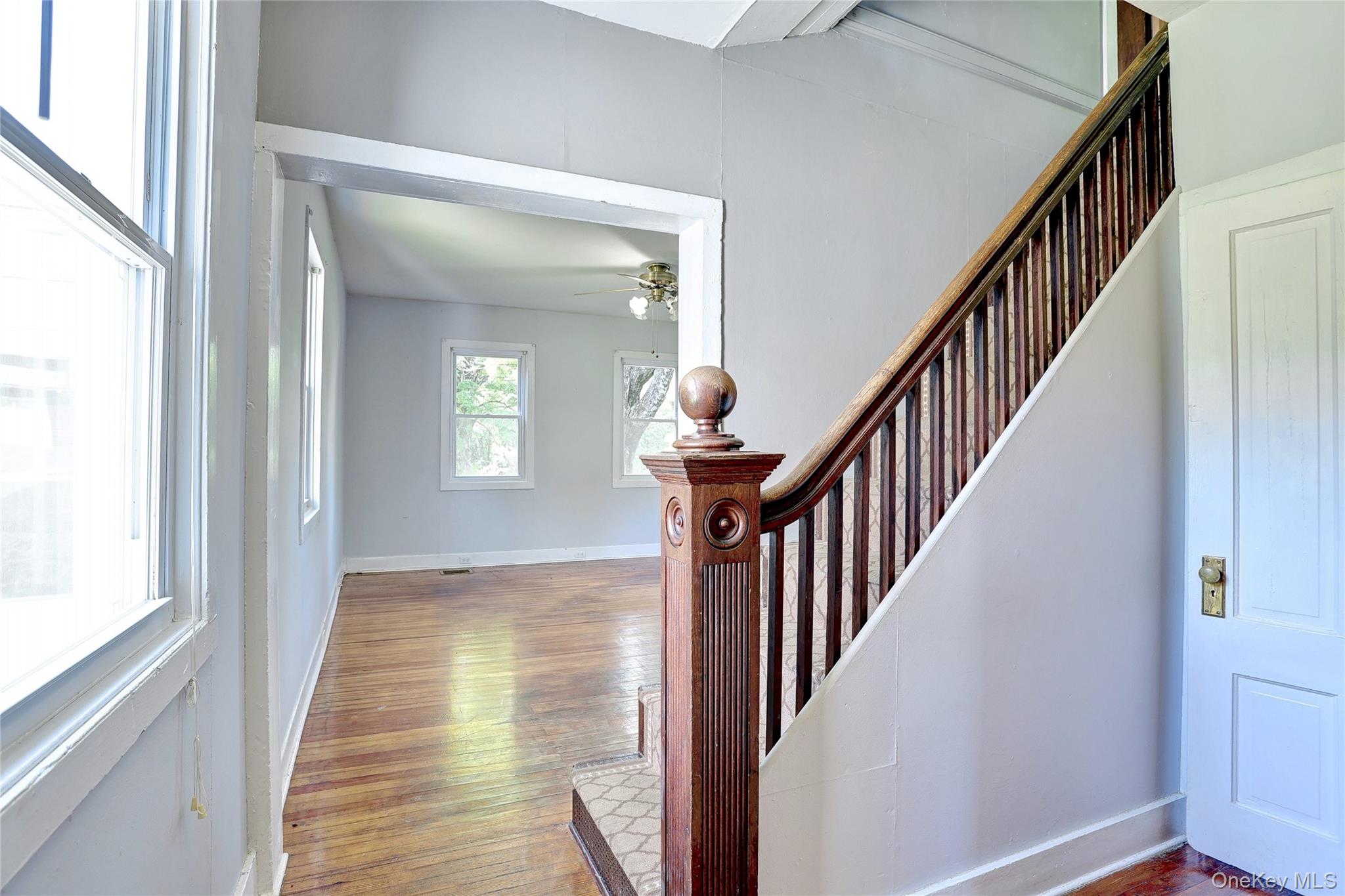 500 Haverstraw Road Suffern, NY 10901 - Photo 8 of 36 a view of an entryway with wooden floor and stairs