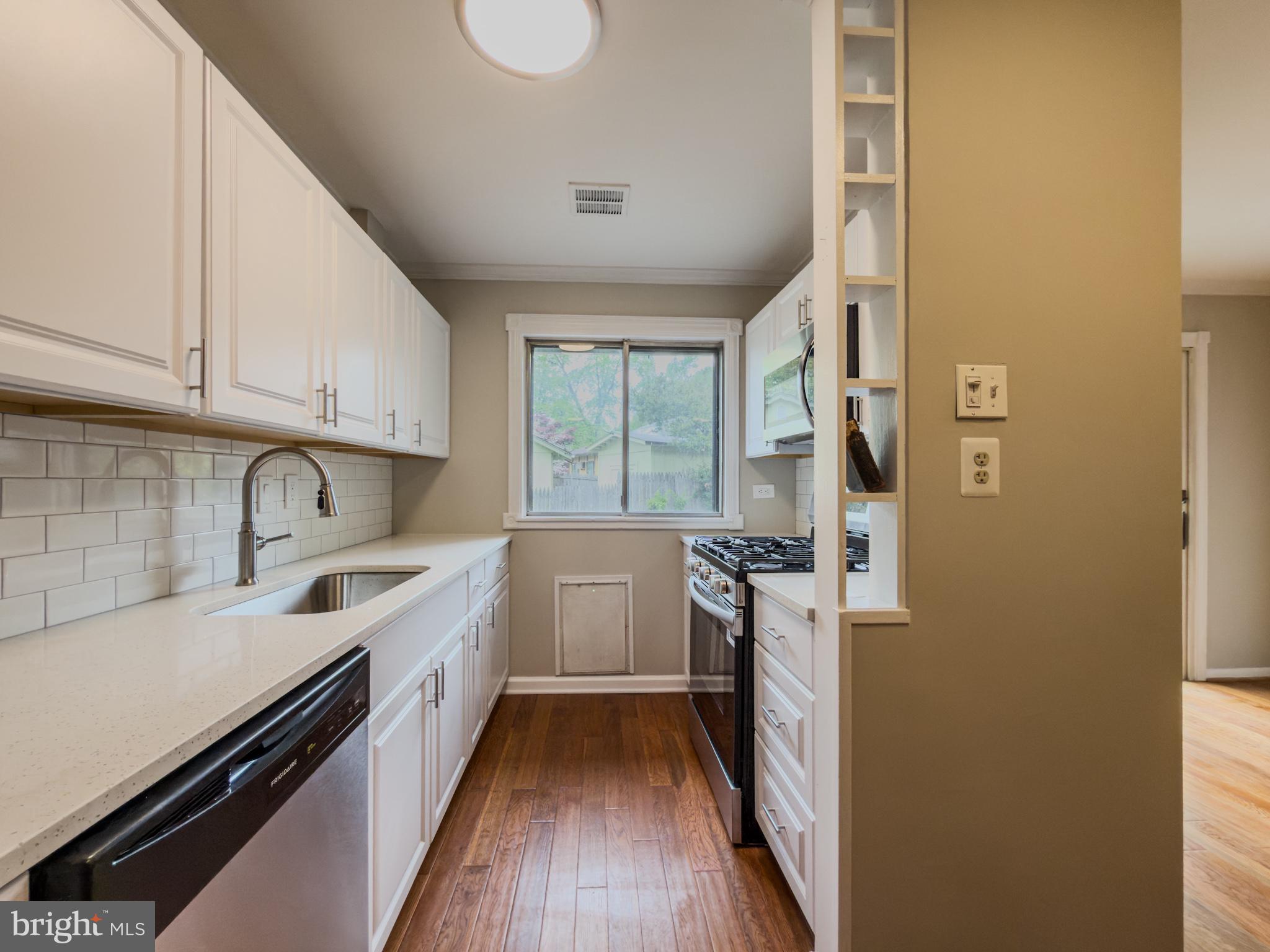 14900 Hydrus Road Silver Spring, MD 20906 - Photo 6 of 33 Bright and inviting modern kitchen.