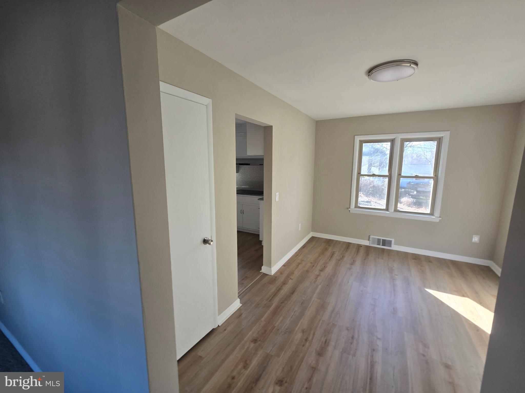 17721 Timberlane Hagerstown, MD 21740 - Photo 11 of 27 an empty room with wooden floor and windows