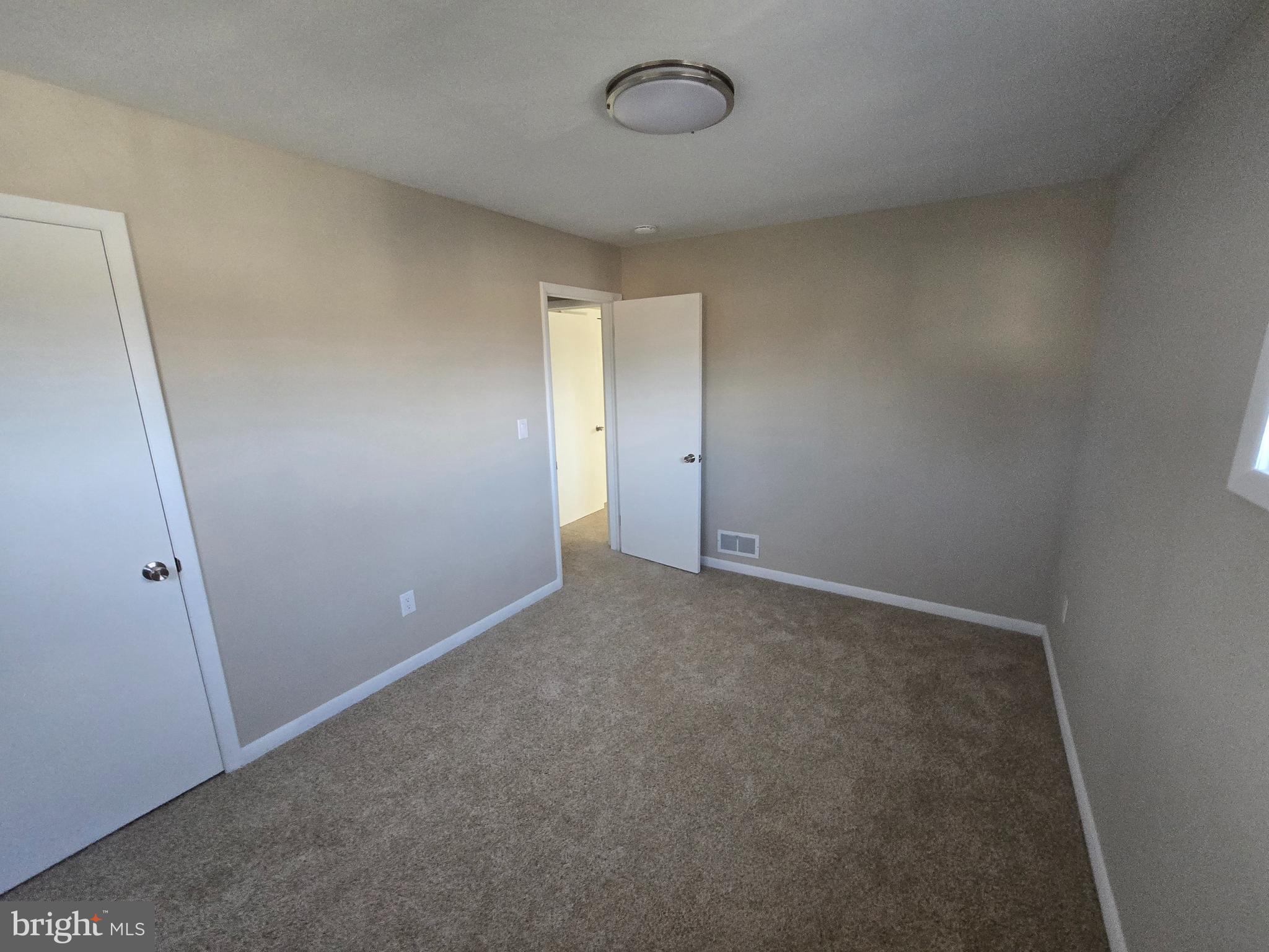 17721 Timberlane Hagerstown, MD 21740 - Photo 18 of 27 an empty room with a empty space and a window