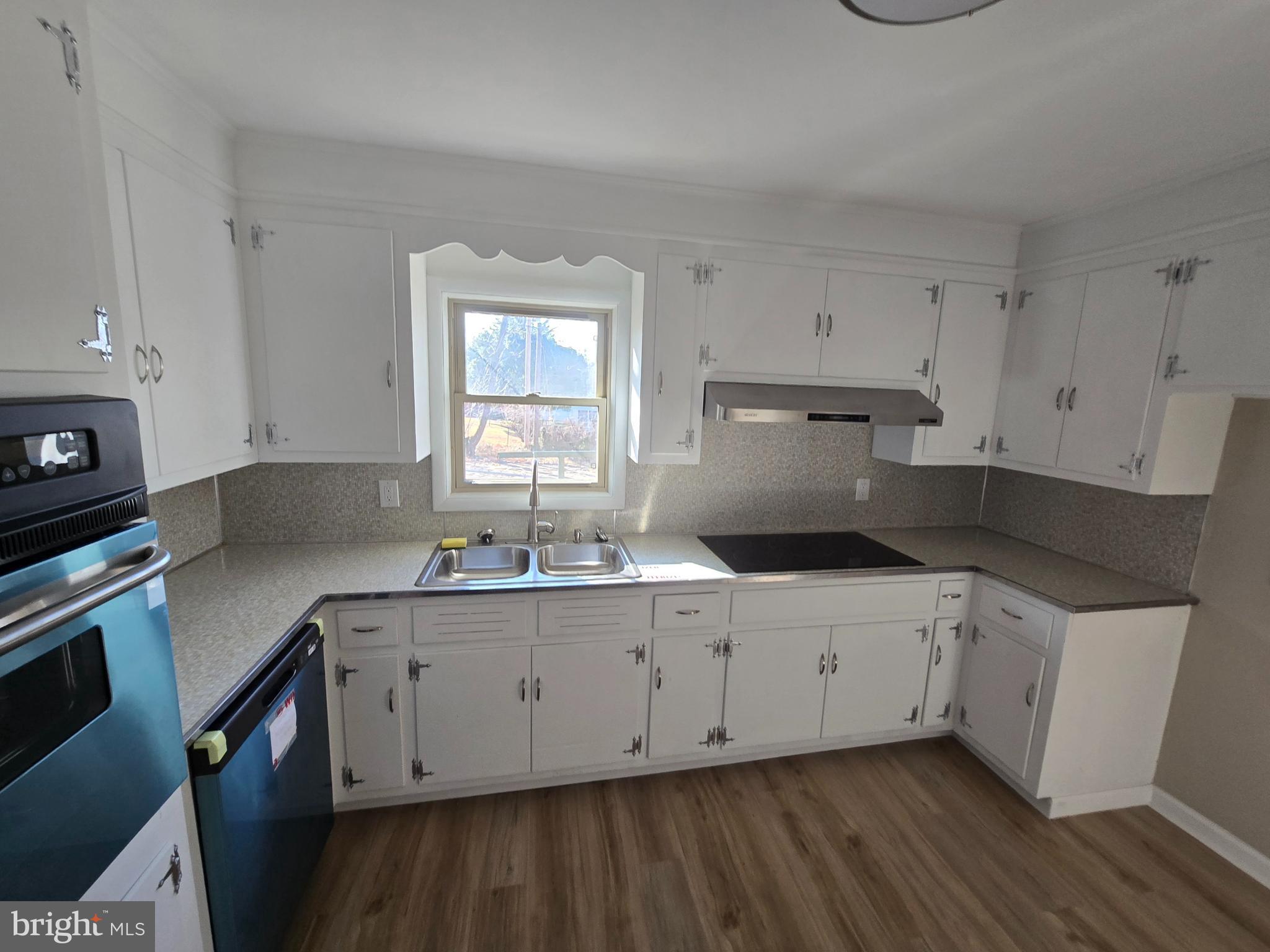 17721 Timberlane Hagerstown, MD 21740 - Photo 22 of 27 a kitchen with a sink a stove and cabinets