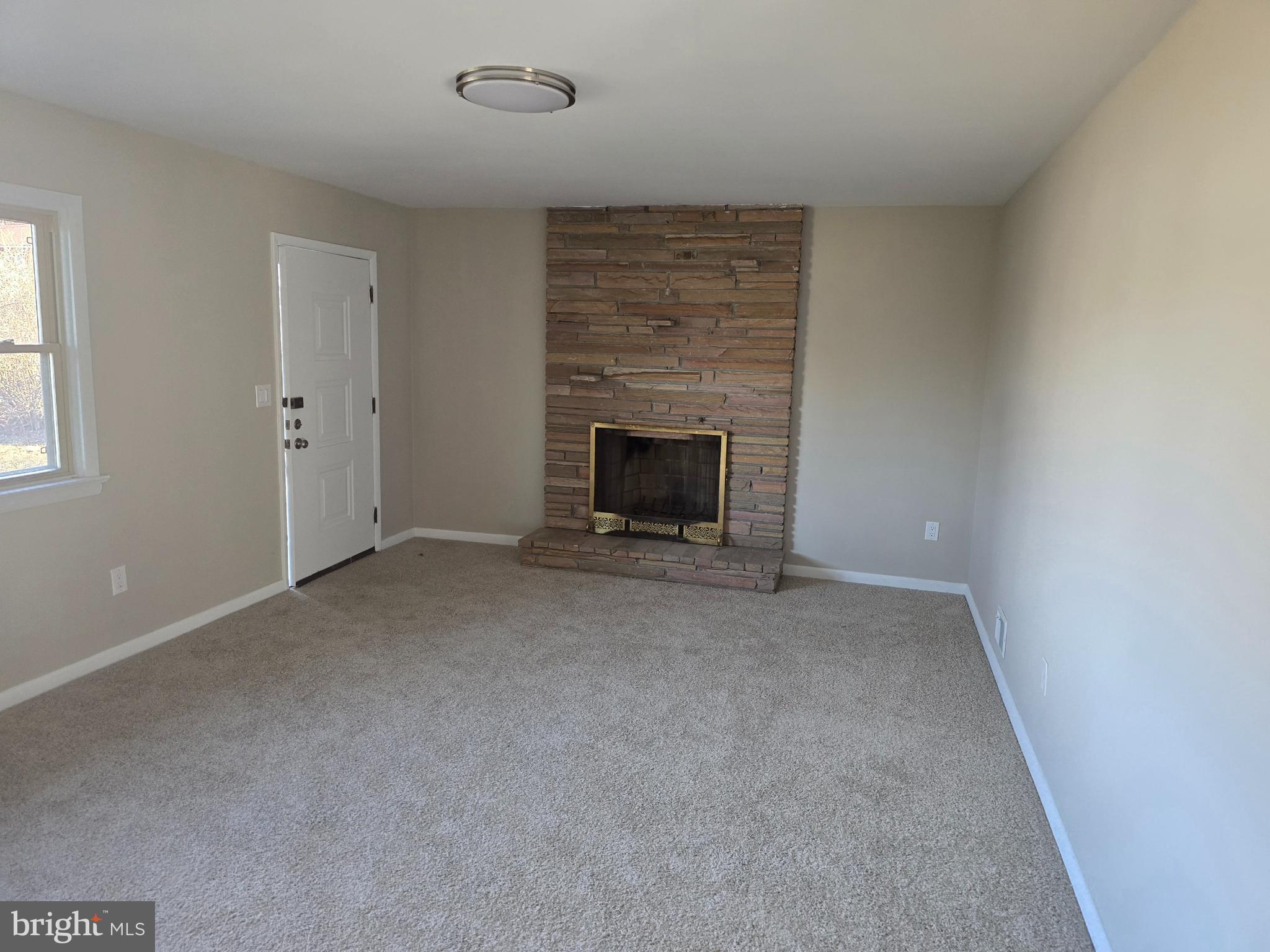 17721 Timberlane Hagerstown, MD 21740 - Photo 4 of 27 an empty room with a fireplace