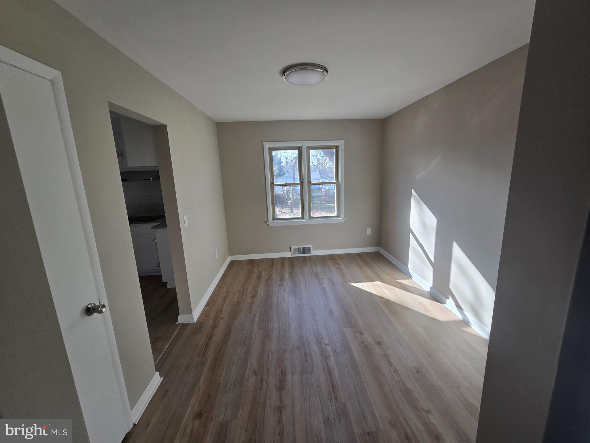 17721 Timberlane Hagerstown, MD 21740 - Photo 6 of 27 wooden floor in an empty room with a window