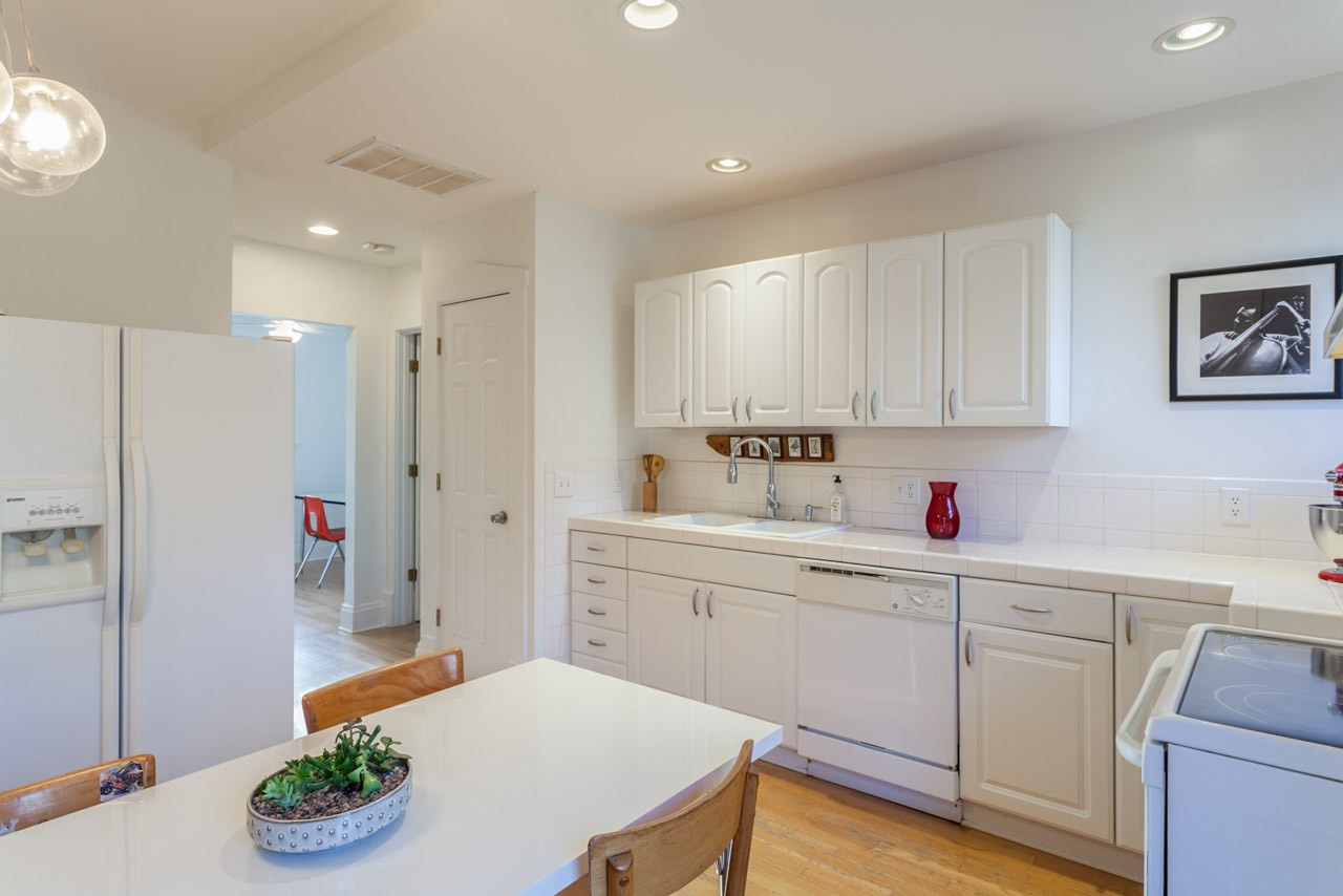 500 Frank Street Raleigh, NC 27604 - Photo 7 of 23 A pantry provides kitchen storage, and past that you'll find the study and back yard.