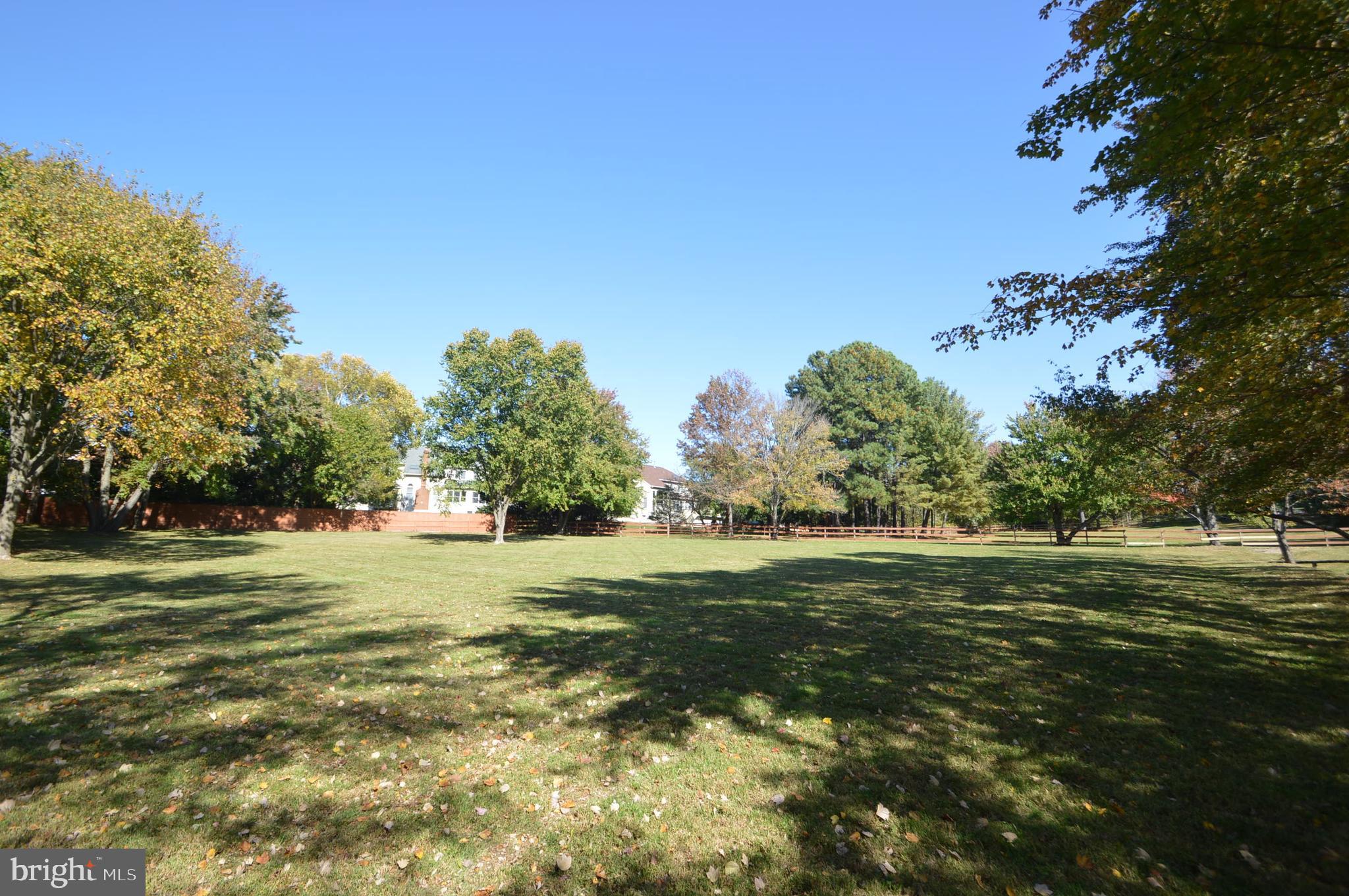 12614 Oxon Road Herndon, VA 20171 - Photo 18 of 71 a big yard with trees in the background