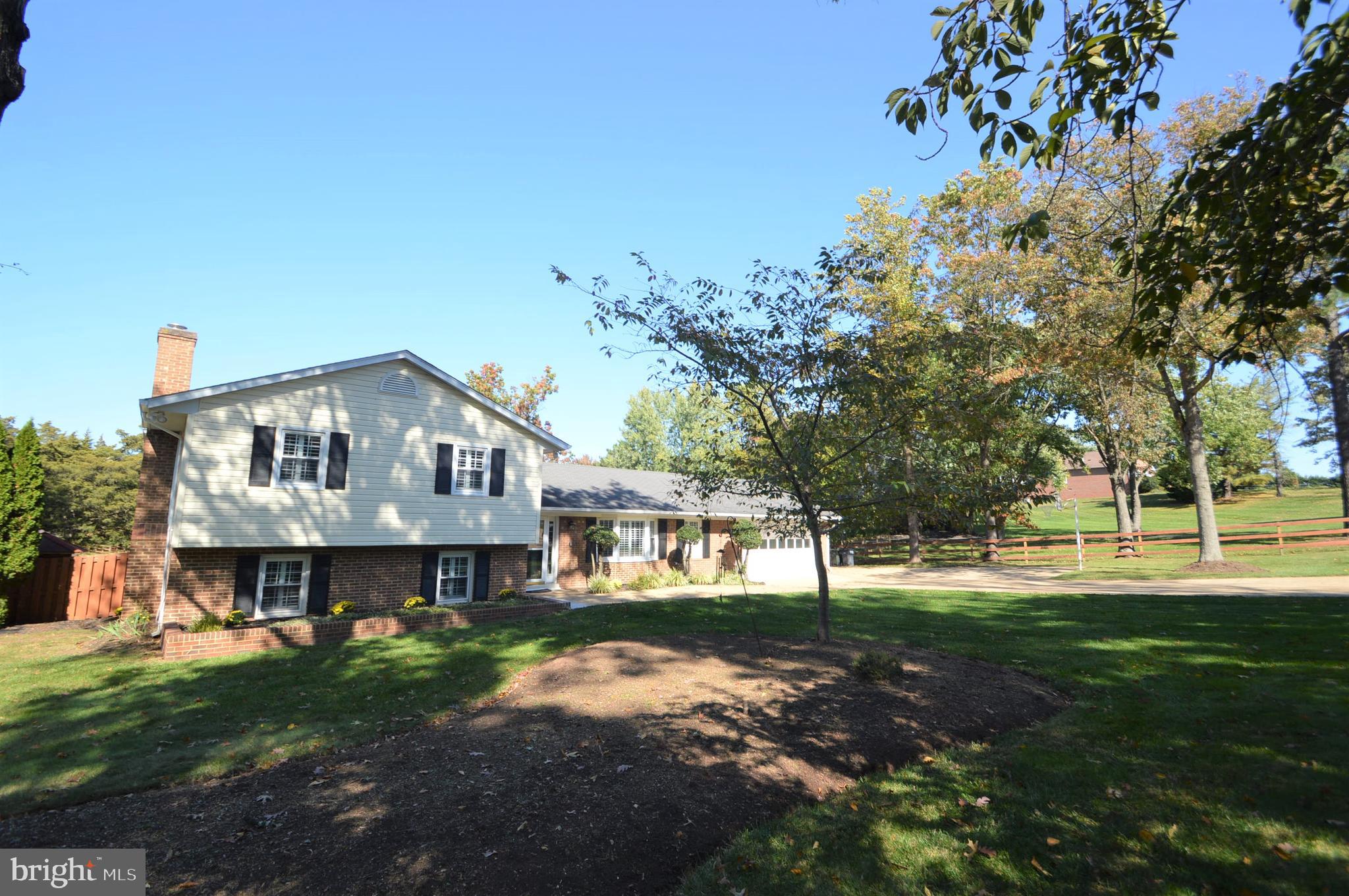 12614 Oxon Road Herndon, VA 20171 - Photo 2 of 71 a view of a house with a yard
