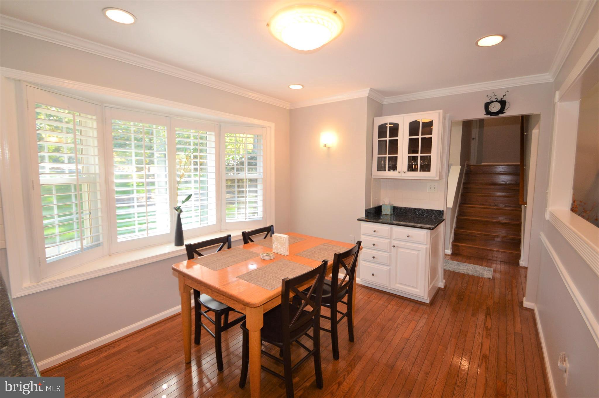 12614 Oxon Road Herndon, VA 20171 - Photo 26 of 71 a view of a dining room with furniture window and wooden floor