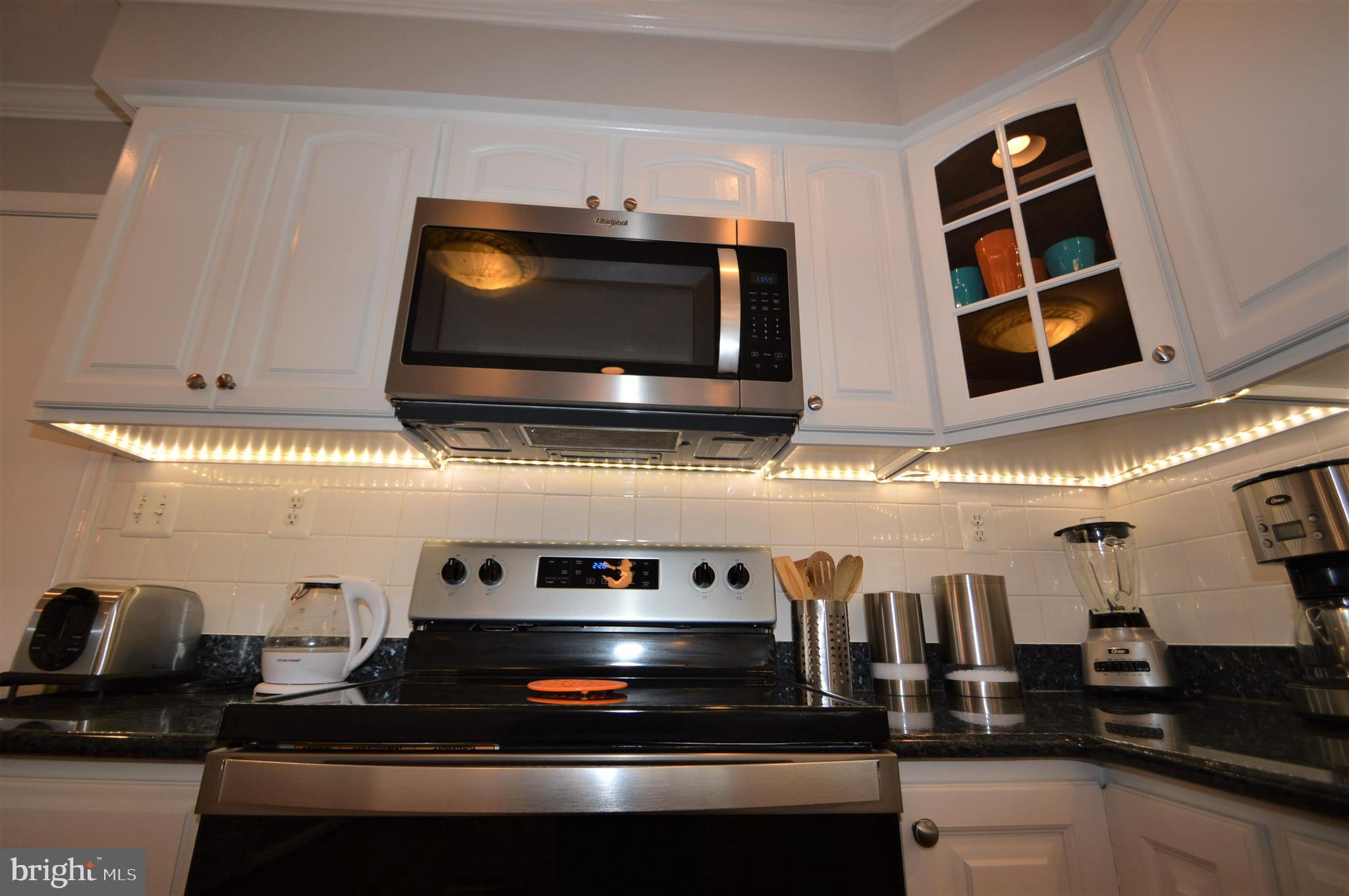 12614 Oxon Road Herndon, VA 20171 - Photo 34 of 71 a kitchen with appliances and cabinets