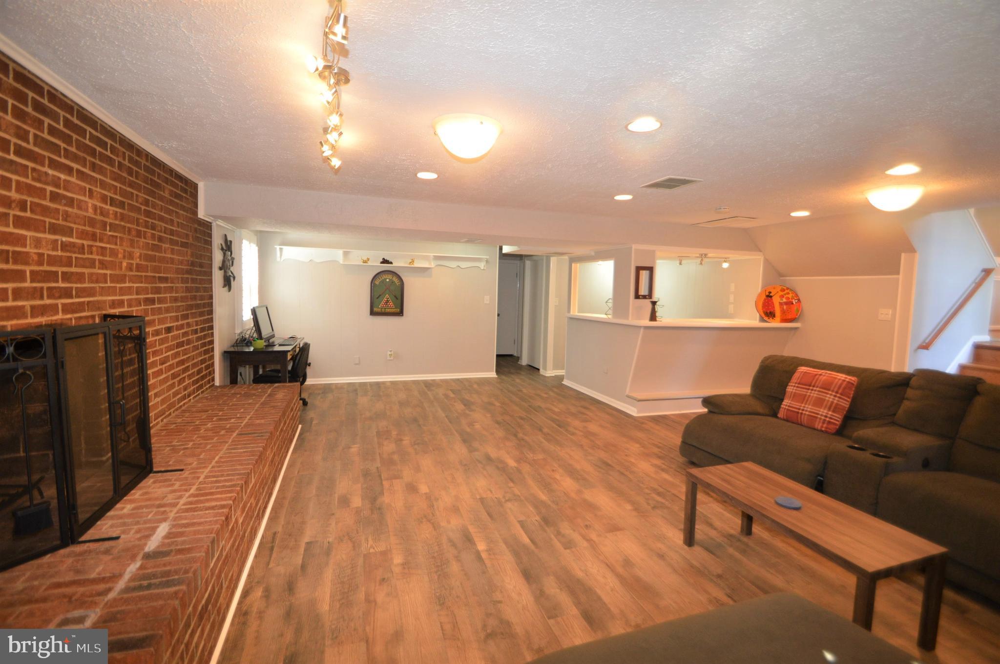 12614 Oxon Road Herndon, VA 20171 - Photo 56 of 71 a view of livingroom with furniture and wooden floor