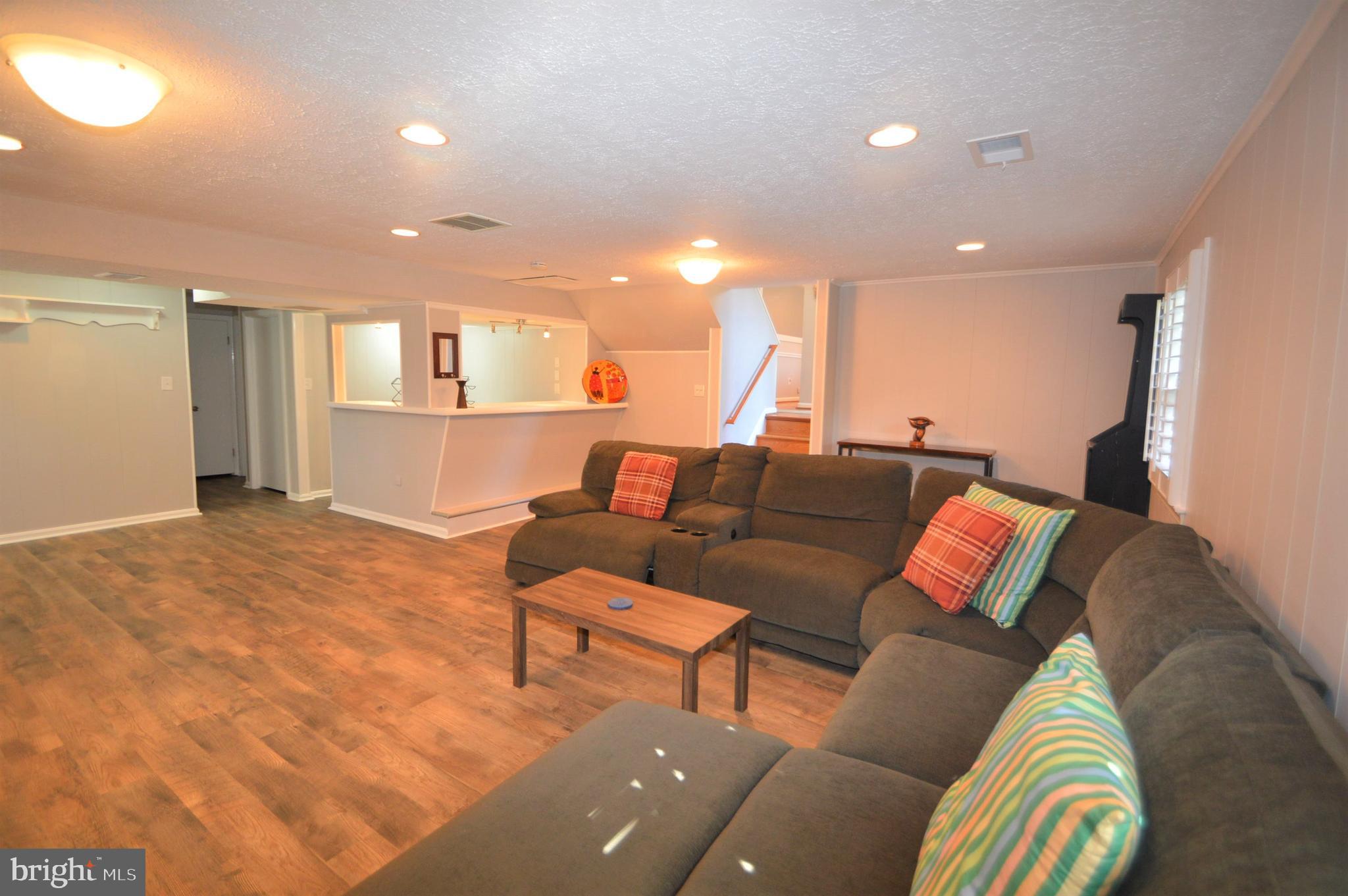 12614 Oxon Road Herndon, VA 20171 - Photo 57 of 71 a living room with furniture and a couch