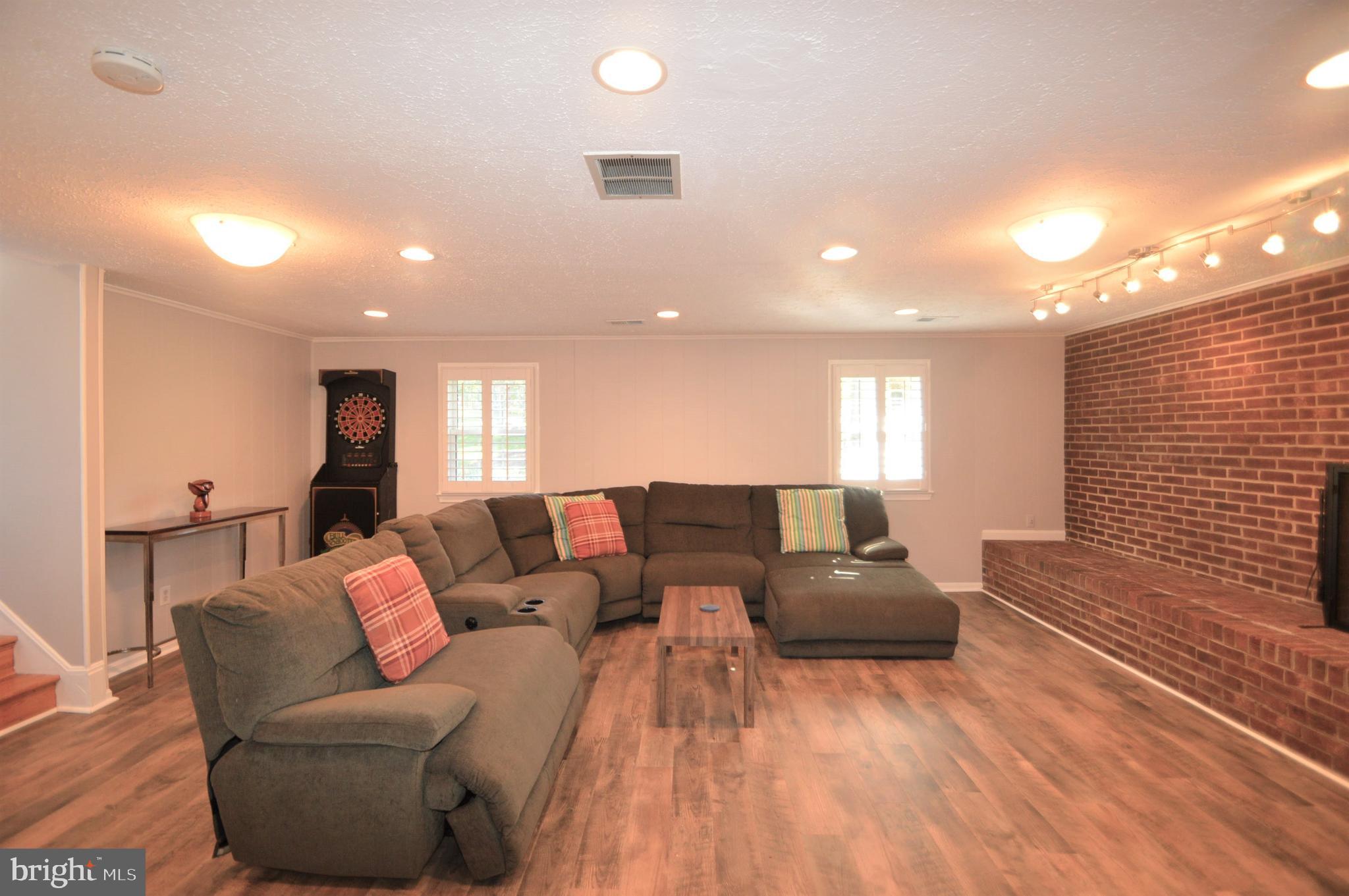 12614 Oxon Road Herndon, VA 20171 - Photo 59 of 71 a living room with furniture and a wooden floor
