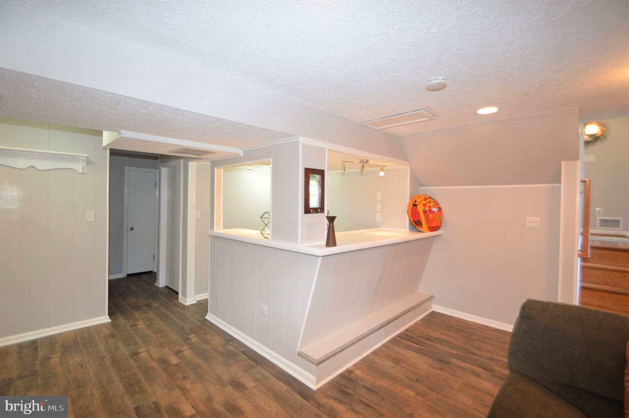 12614 Oxon Road Herndon, VA 20171 - Photo 63 of 71 a view of a kitchen cabinets and chandelier