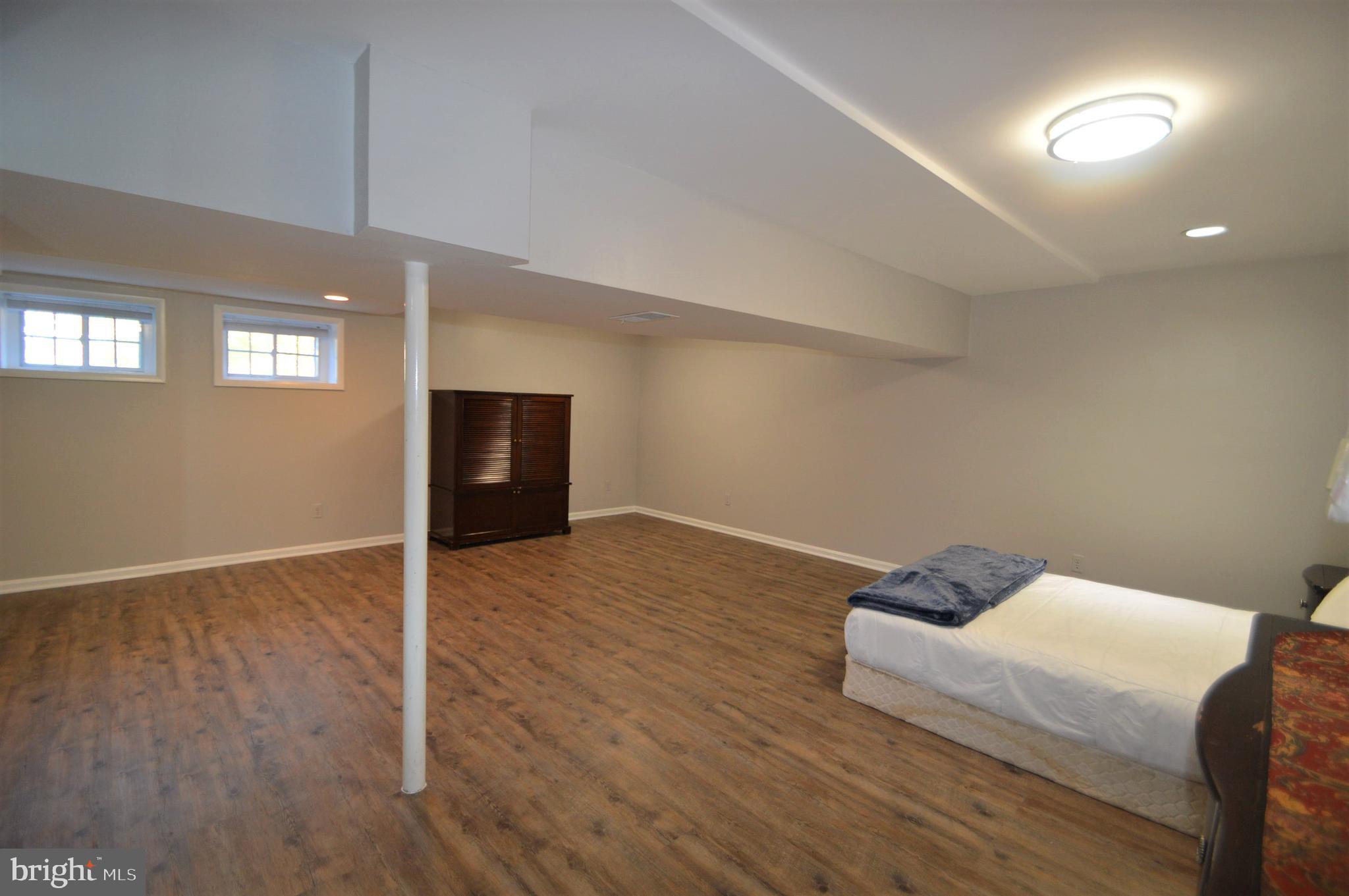 12614 Oxon Road Herndon, VA 20171 - Photo 70 of 71 a living room with hard wood floors and a window