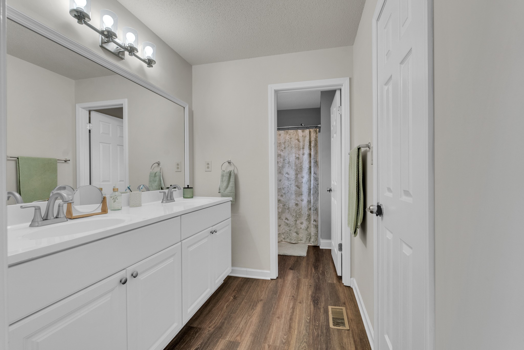 326 Lancaster Road Clarksville, TN 37042 - Photo 15 of 31 a en suite bathroom with a double vanity sink and a mirror