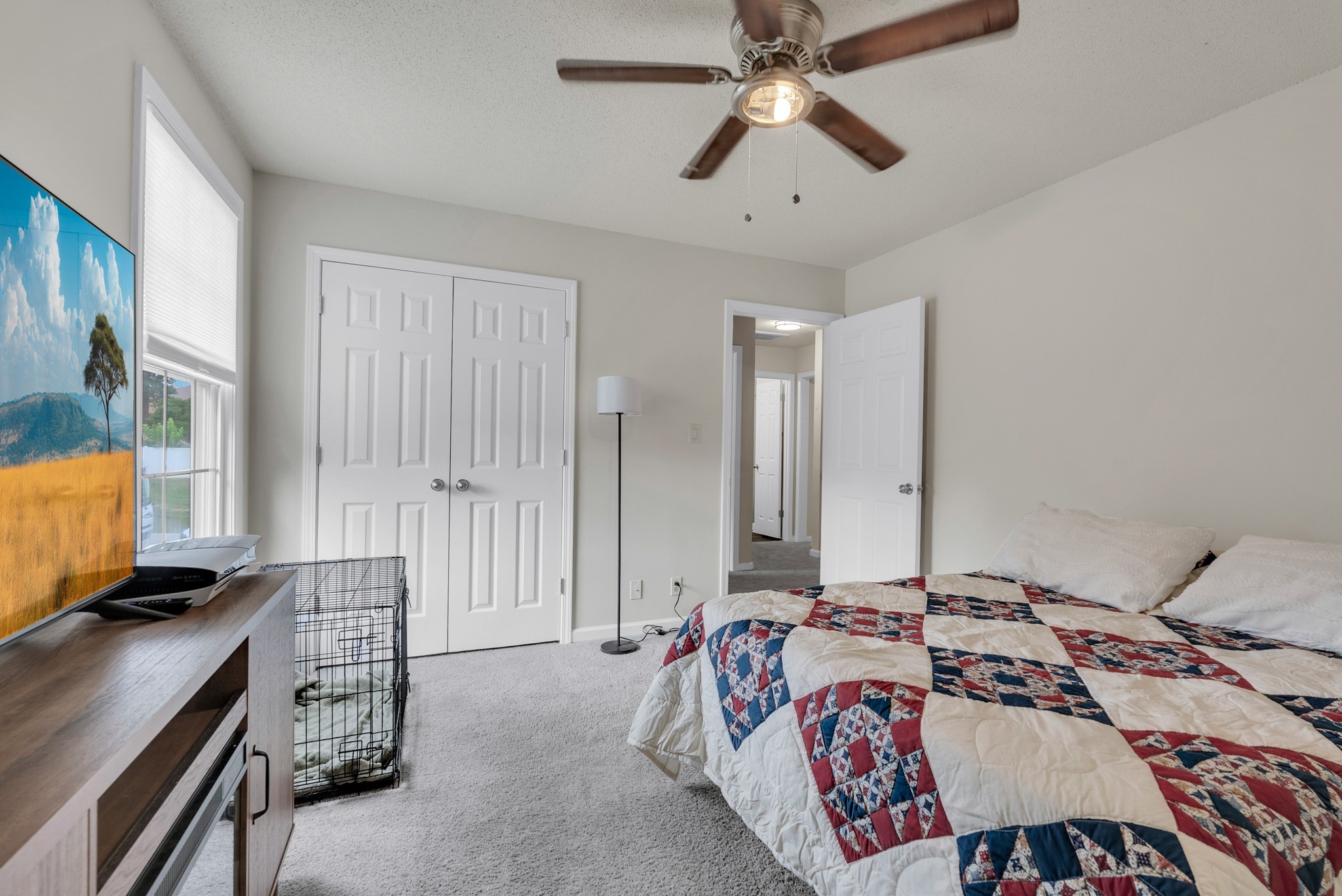 326 Lancaster Road Clarksville, TN 37042 - Photo 20 of 31 a bedroom with a bed and a chandelier