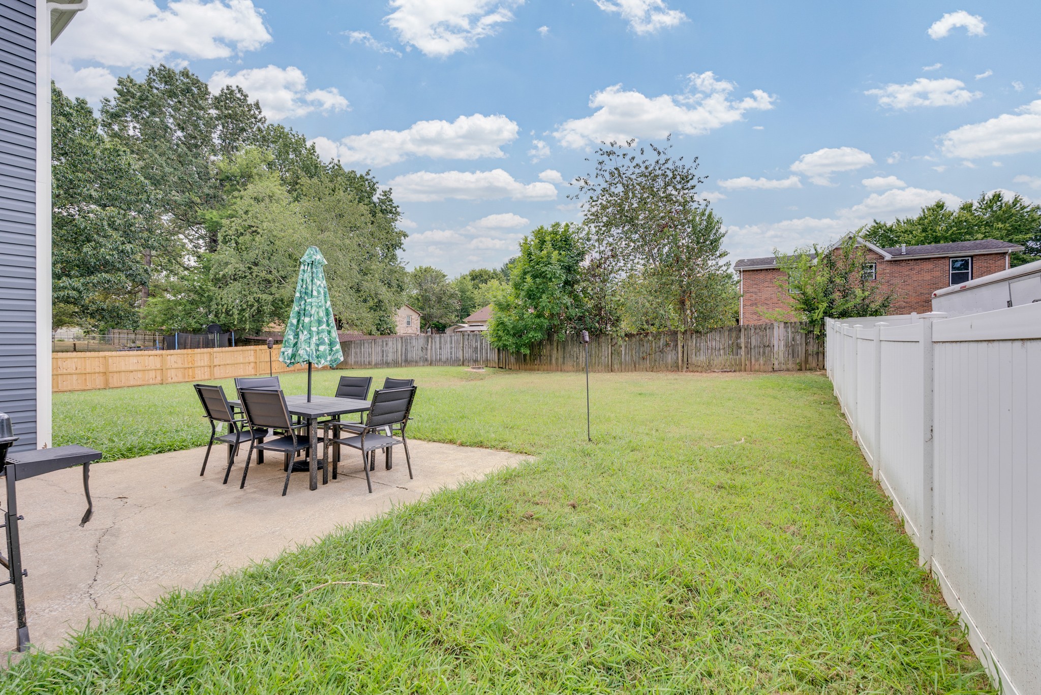 326 Lancaster Road Clarksville, TN 37042 - Photo 31 of 31 a view of a backyard with a garden and seating