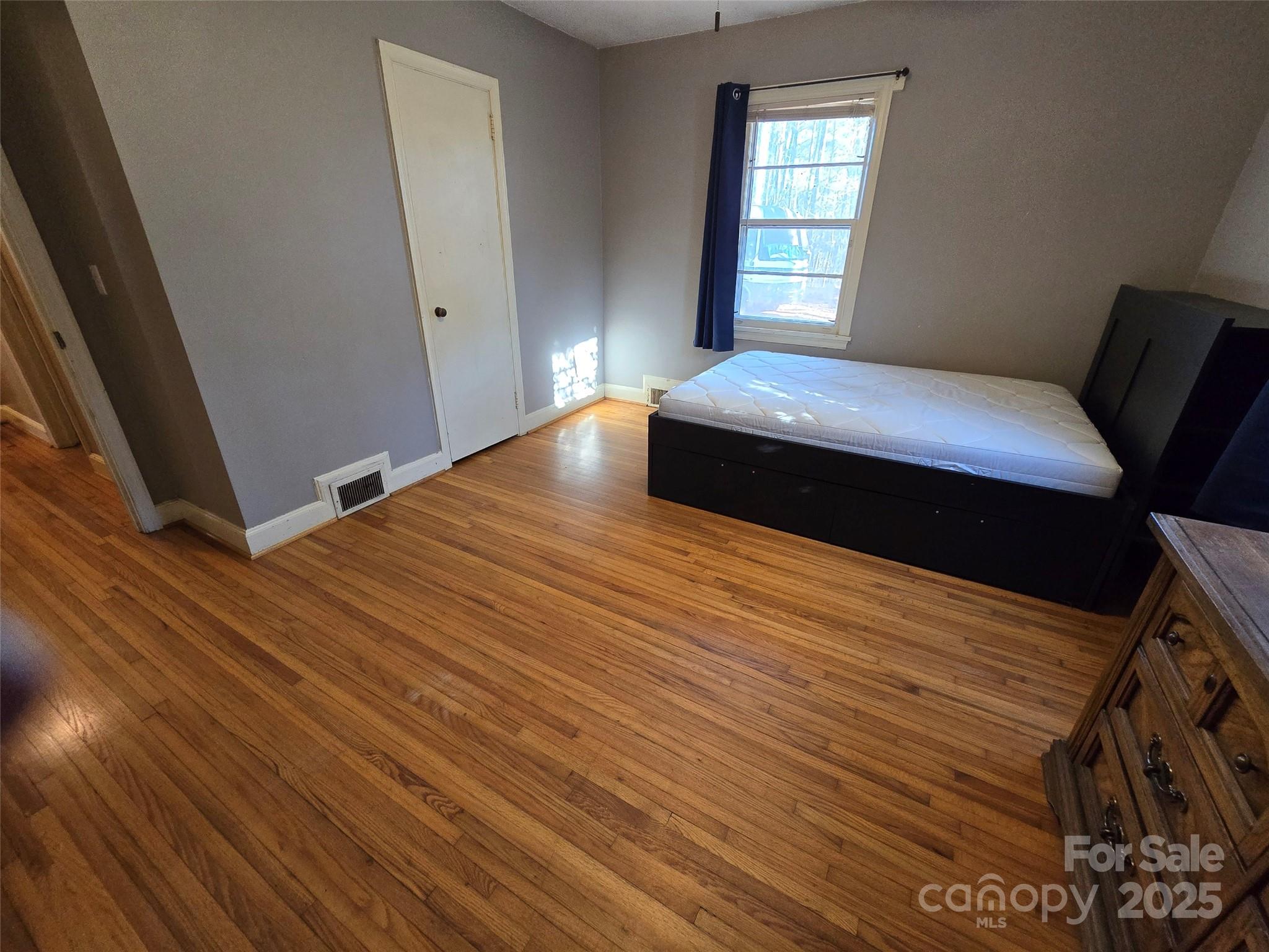 160 Williamson Street Troy, NC 27371 - Photo 15 of 24 a bedroom with a bed and window