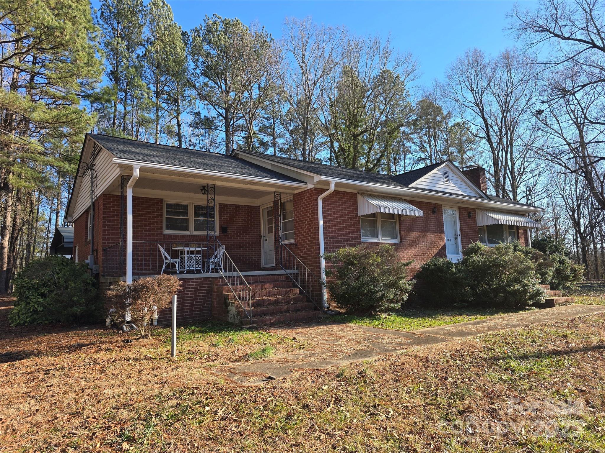 160 Williamson Street Troy, NC 27371 - Photo 18 of 24 a front view of a house with a yard