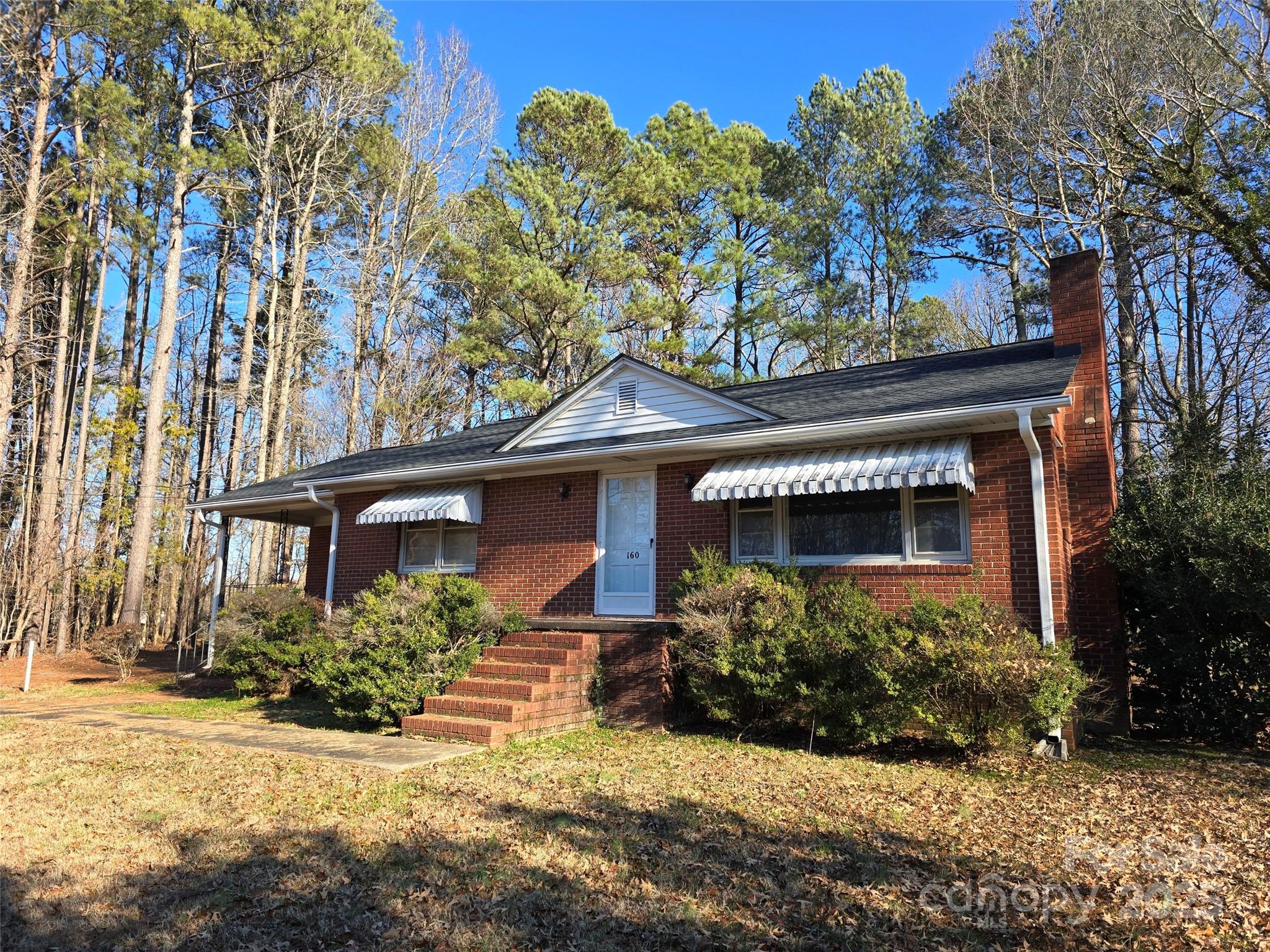 160 Williamson Street Troy, NC 27371 - Photo 19 of 24 front view of a house with a yard