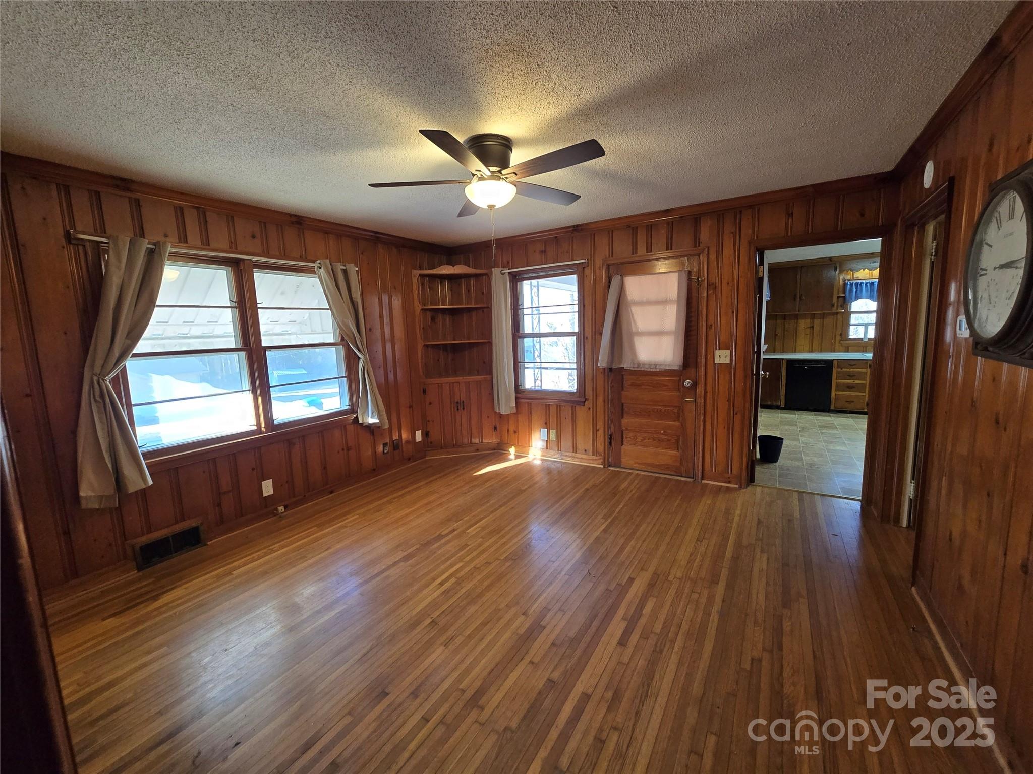 160 Williamson Street Troy, NC 27371 - Photo 5 of 24 a view of an empty room with wooden floor and a window