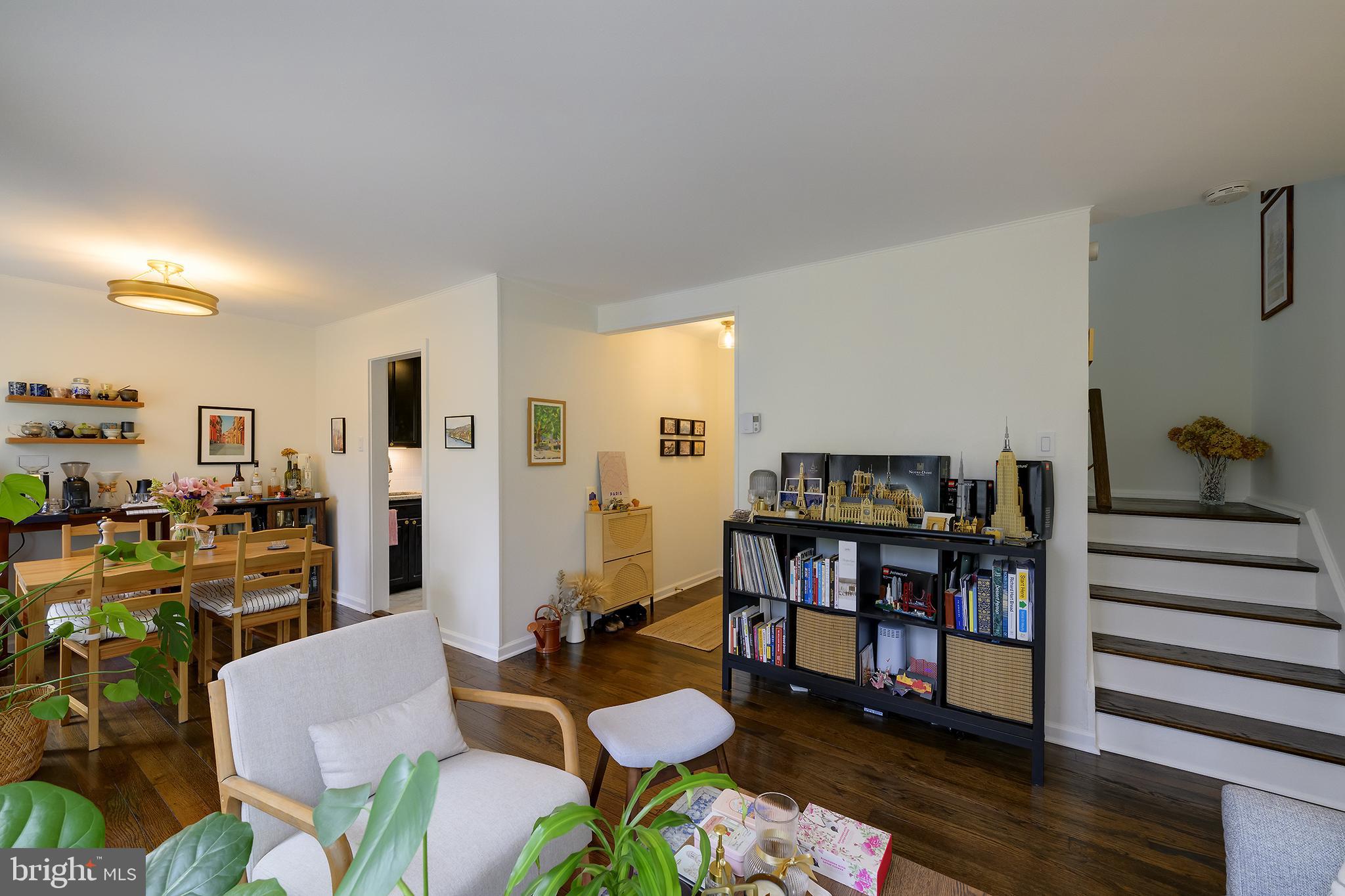 14 Laurel Hill Road Greenbelt, MD 20770 - Photo 11 of 41 a living room with furniture kitchen view and a wooden floor